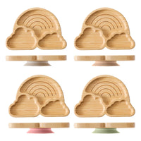 Set of eco-friendly baby wooden tableware with bamboo rainbow and cloud-shaped plates and silicone suction bases for safe feeding