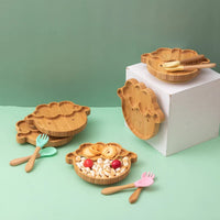 Cartoon bamboo baby feeding set with non-slip plate, spoon, and fork for self-feeding.