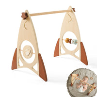 Montessori wooden baby activity gym with foldable rocket frame and sensory toys for infants.